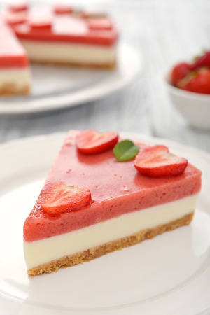 Strawberry cheesecake with fresh berries on plate closeupの写真素材