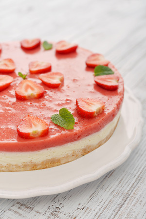 Strawberry cheesecake with fresh berries on plate closeupの写真素材