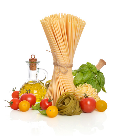 Italian Pasta with tomatoes, olive oil and basil on a white backgroundの写真素材