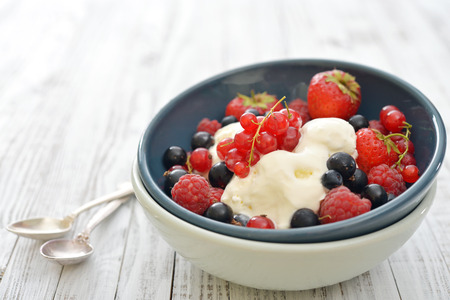 Ice cream with fresh berries in bowl closeupの写真素材