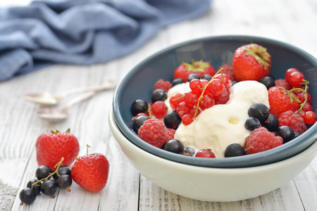 Ice cream with fresh berries in bowl closeupの写真素材
