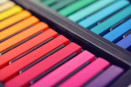 Multicolored artist's pastels in box, small shallow DOFの写真素材