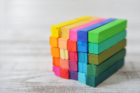 The cube from multicolored artist's pastels on light backgroundの写真素材
