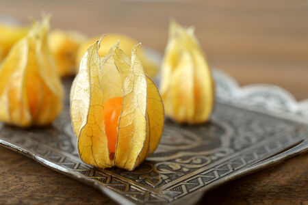 Physalis fruits closeup on wooden backgroundの写真素材