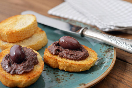 Bread with olive pate on plate closeup. Greek cuisineの写真素材
