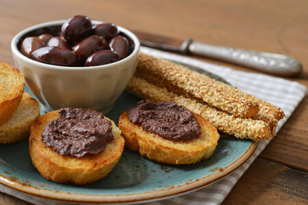 Bread with olive pate on plate closeup. Greek cuisineの写真素材