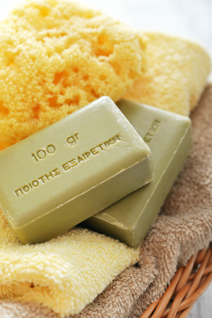 Greek olive soap with bath towels  in basket closeupの写真素材