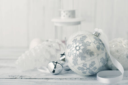 White christmas ball with decorations on light backgroundの写真素材