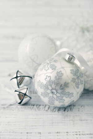 White christmas balls with decorations on light backgroundの写真素材