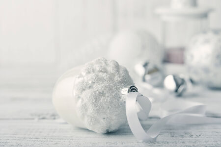 White christmas balls with decorations on light backgroundの写真素材