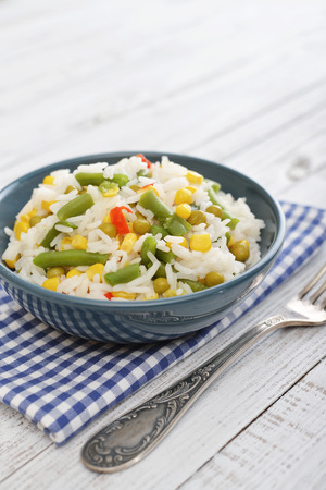 Vegetable risotto on plate on wooden backgroundの写真素材