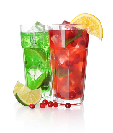 Red berry cocktail drink with cranberry and drink with lime isolated on whiteの写真素材