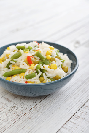Vegetable risotto on plate on wooden backgroundの写真素材