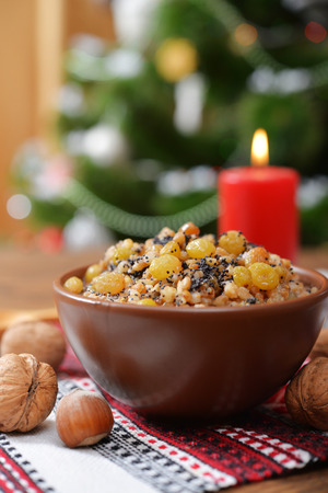 Traditional Christmas slavic dish kutia in ceramic bowl with fir treeの写真素材