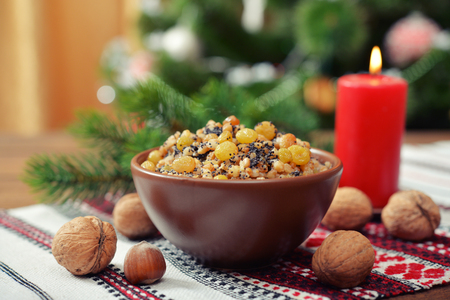 Traditional Christmas slavic dish kutia in ceramic bowl with fir treeの写真素材