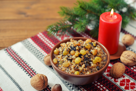 Traditional Christmas slavic dish kutia in ceramic bowl with fir treeの写真素材