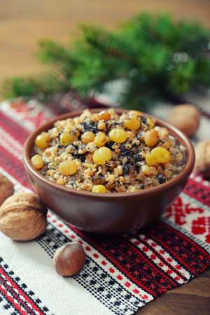 Traditional Christmas slavic dish kutia in ceramic bowl with fir treeの写真素材