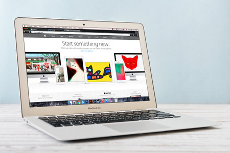 KIEV, UKRAINE - JANUARY 29, 2015: Studio shot of brand new Apple MacBook Air Early 2014 with home page of Apple Inc. site on screen, designed and developed by Apple Inc., it was released on April 29, 2014のeditorial素材