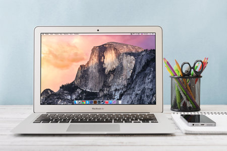 KIEV, UKRAINE - JANUARY 29, 2015: Studio shot of brand new Apple MacBook Air Early 2014 with home page on screen, designed and developed by Apple Inc., it was released on April 29, 2014のeditorial素材