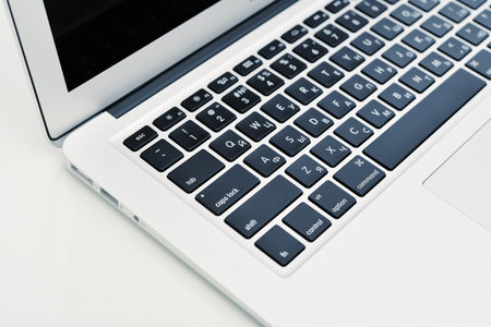 KIEV, UKRAINE - JANUARY 29, 2015: Studio shot part of brand new Apple MacBook Air Early 2014, designed and developed by Apple Inc., it was released on April 29, 2014のeditorial素材