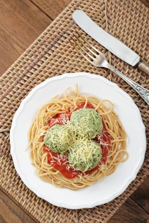 Pasta with chicken meatballs and tomato sauce on plate closeupの写真素材