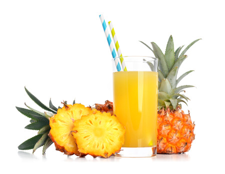 Pineapple juice in glass with fresh fruits isolated on whiteの写真素材