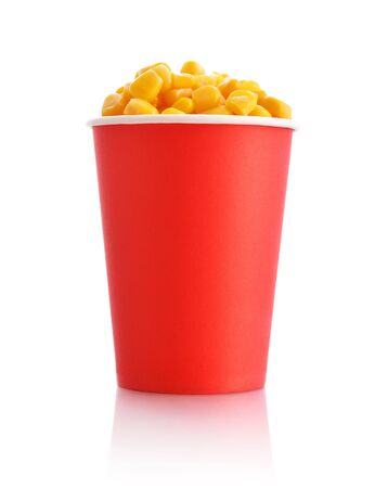 Boiled corn kernels in red paper cup isolated on whiteの写真素材
