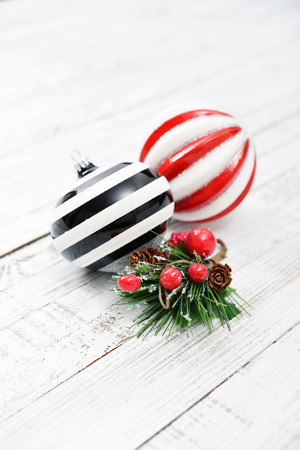 Two christmas striped balls  on wooden backgroundの写真素材
