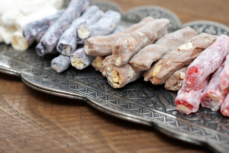 Turkish delight with nuts on metal tray closeup.の写真素材