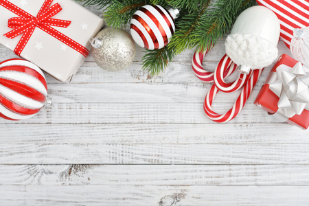 Christmas decorations with fir tree and gift boxes on wooden backgroundの写真素材