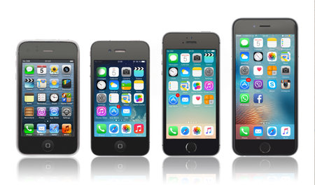 Kiev, Ukraine - March 05, 2016: Front view of a space grey color iPhones 6, 5s, 4 and 3gs generation showing the home screens. Isolated on white.のeditorial素材