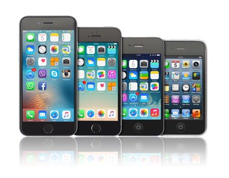 Kiev, Ukraine - March 05, 2016: Front view of a space grey color iPhones 6, 5s, 4 and 3gs generation showing the home screens. Isolated on white.のeditorial素材