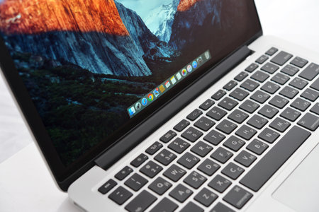 Kiev, Ukraine - May 15, 2016: Apple MacBook Pro with Retina Display on the white surface. It is a laptop computer that produced by Apple Inc.のeditorial素材