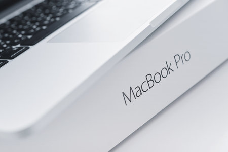 Kiev, Ukraine - May 15, 2016: Apple MacBook Pro with Retina Display on the surface of original box with lettering MacBook Pro closeup. It is a laptop computer that produced by Apple Inc.のeditorial素材