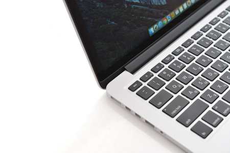 Kiev, Ukraine - May 15, 2016: Apple MacBook Pro with Retina Display on the white surface. It is a laptop computer that produced by Apple Inc.のeditorial素材
