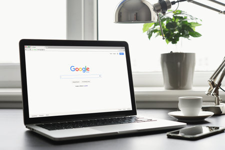 Kiev, Ukraine - May 15, 2016: Macbook Pro with Google app on screen. Google biggest Internet search engine. Google.com domain was registered September 15, 1997.のeditorial素材