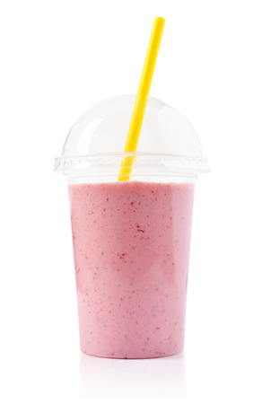 Strawberry smoothie in plastic transparent cup isolated on white backgroundの写真素材