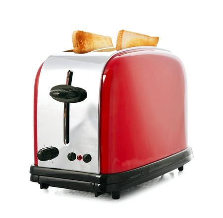 Toaster with bread isolated on white backgroundの写真素材
