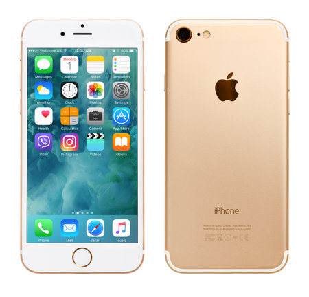 Kyiv, Ukraine - May 1, 2017: Front view of Gold Apple iPhone 7 with iOS 10.3.1 mobile operating system and back side with Apple Inc logo. Isolated on white with clipping path.のeditorial素材