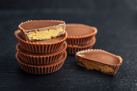 Peanut butter cups, chocolate dessert on black background  closeupの写真素材