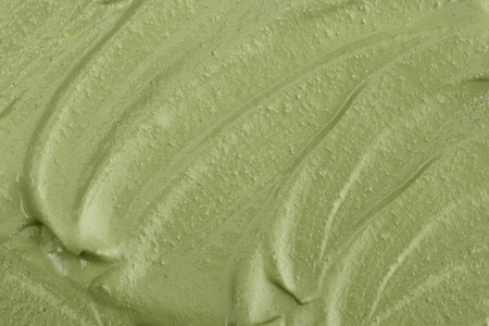 Texture of green clay mask cream to the face and body closeup.  May use as backgroundの写真素材