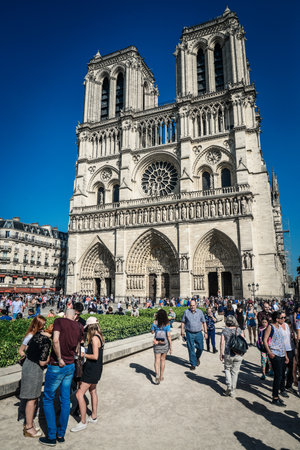 Paris, France - May 6, 2018: People are walking near Notre Dame de Paris cathedral, France. The most popular city landmarkのeditorial素材