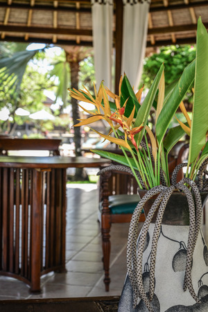 Pavilion with beautiful Strelitzia flowers  in luxury resort on Bali islandの写真素材