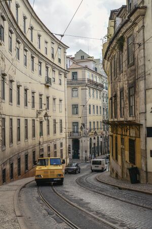 LISBON, PORTUGAL - JULY 4, 2019: Narrow cobblestone streets of the Chiado district in Lisbon, Portugalの写真素材