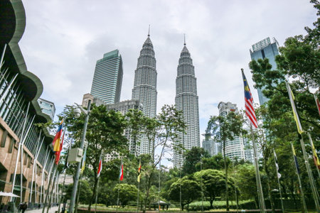 KUALA LUMPUR, MALAYSIA - NOVEMBER 29, 2019: View on Petronas Towers, also known as Menara Petronas, from Central city park in Kuala Lumpur, Malaysia.のeditorial素材