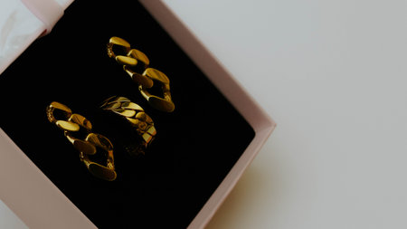 Golden earrings with ring in the box. high quality photo