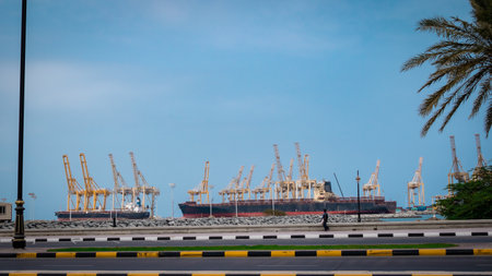 Cargo port and container ship with blue sky and white clouds.の写真素材