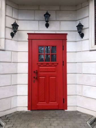 Beautiful red door in a brick wall