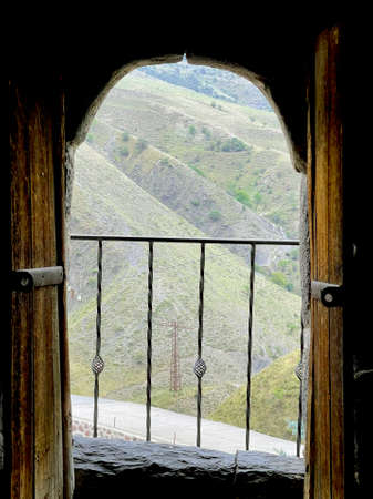 Caucasus mountains from the window in antient tower