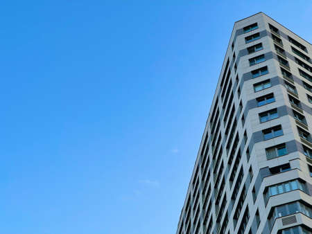 Modern office building on blue sky backgroundの写真素材